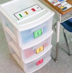 a desk with three bins on top of it