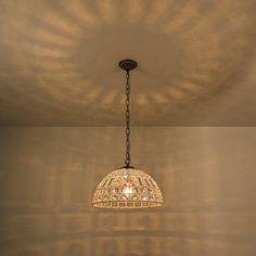 a chandelier hanging from the ceiling in a room