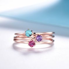 You are looking at a dainty birthstone ring. Stackable wedding band,matching band.A perfect anniversary gift, birthday gift,wedding engagement ring.Great as a gift for her. Ring Information Stones * Size: 3mm round *Lab created opal *Turquoise *Tourmaline *Moonstone *Amethyst *If you need other birthstone, please fell free to contact me :) Metal * Solid 10k 14k &18k. *Color:white gold,yellow gold,rose gold. Custom Order *The main stone can be other gemstones you can imagine,any birthstone ca Adjustable Rose Gold Crystal Ring With Birthstone, Rose Gold Birthstone Crystal Ring For Promise, Pink Birthstone Ring With Round Band, Dainty Rose Gold Amethyst Promise Ring, Pink Stackable Birthstone Promise Ring, Rose Gold Sterling Silver Birthstone Promise Ring, Fine Jewelry Rose Gold Birthstone Ring For May, Rose Gold May Birthstone Ring In Fine Jewelry Style, Minimalist Rose Gold Stackable Gemstone Rings