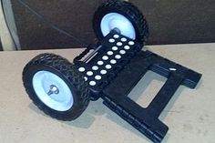 a toy car made out of plastic wheels