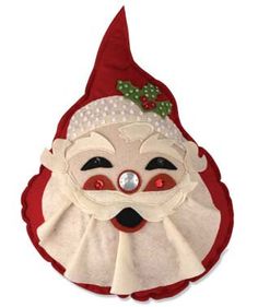 a red and white santa claus mask with a green bow