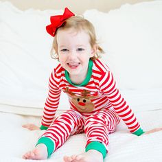 These Oh Deer Red Stripe Knit Pajamas will have your little ones all set for Christmas morning! These unisex Christmas PJs make it easy to match brothers, sisters, cousins, and friends for the coziest holiday of the year. The pajama top features an adorable Rudolph appliqué on soft red stripe knit with green ribbing. The set includes matching red stripe pajama bottoms. Add a monogram to personalize your Christmas look! Designed to be snug-fitting. Please check the Size Chart for measurements and