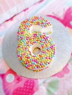 a doughnut with sprinkles and a number on it