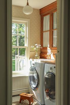 a washer and dryer in a small room