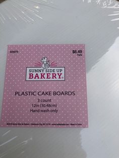 a plastic cake board sitting on top of a table