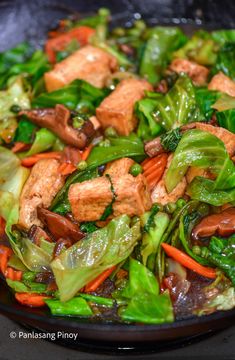 stir fry with chicken and vegetables in a wok