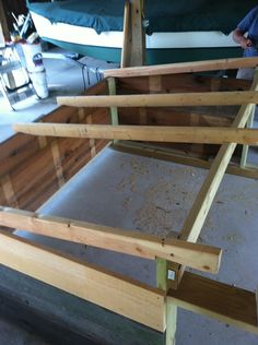 there are three pieces of plywood being assembled for the bed frame to be built