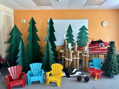 there are many different chairs and trees in this office setting, all made out of construction materials