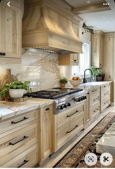 a large kitchen with wooden cabinets and marble counter tops, along with an area rug on the floor