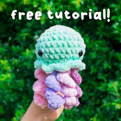 a hand holding up a crocheted octopus with the words free pattern below it