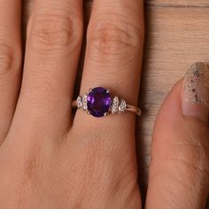 It is natural amethyst ring, the main stone is about 7mm*9mm, oval cut, weight about 1.77 carats. The basic metal is sterling silver and plated with rhodium. To change the metal to a solid gold (white/rose) or platinum is also available, please ask for a quotation if you want. You can also go to my shop Home for more elegant rings: https://www.etsy.com/shop/godjewelry?ref=hdr_shop_menu Amethyst is February birthstone. More amethyst rings: https://www.etsy.com/shop/godjewelry?ref=seller-platform- Elegant Oval Amethyst Promise Ring, Classic Oval Purple Birthstone Ring, Elegant Oval Amethyst Birthstone Ring, Silver Oval Solitaire Amethyst Ring, Silver Solitaire Oval Amethyst Ring, Classic Oval Amethyst Ring With Halo Setting, Oval Amethyst Promise Ring In White Gold, White Gold Amethyst Promise Ring With Oval Shape, White Gold Oval Amethyst Promise Ring