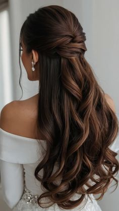 a woman with long hair wearing a wedding dress