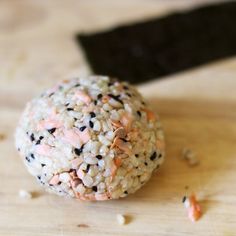 a ball of food sitting on top of a wooden table