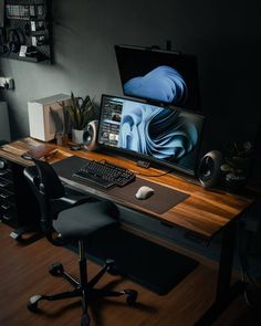 a desktop computer sitting on top of a wooden desk