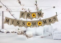 a banner that says from miss to mrs with sunflowers