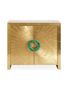 a golden cabinet with a green circle in the center