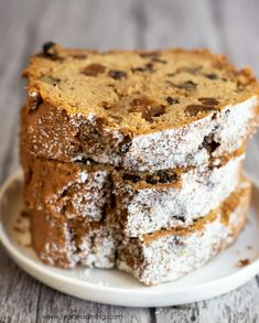 three pieces of cake sitting on top of a white plate