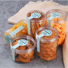 six plastic containers filled with different types of snacks