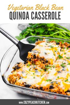 vegetarian black bean quinoa casserole in a glass dish with a serving spoon