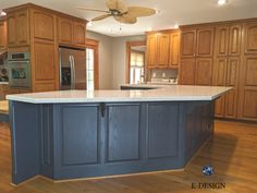 a large kitchen with an island in the middle