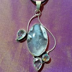 This Is A Gorgeous, Silver Piece With A Dendrite Opal And Gemstone Mystic Topaz Accent Pieces. I Think This Handmade Piece Is Exceptionally Beautiful. If I Weren't In The Business Of Selling Jewelry, This One Would Be Mine!!! I Love The Elegance And Classy Look Of It. The Dendrite Opal Is An Exceptional Piece All By Itself. The Mystic Topaz Makes It Pop! The Pendant Measures Approximately 2 1/2"X 1 1/4". It Comes With A Black Corded Necklace With An Extension. I Hope You Like It Too! Thanks For White Mystical Pendant Jewelry, Mystical White Pendant Jewelry, White Mystical Gemstone Necklace, Mystical Silver Necklace With Mineral Crystal, Mystical Silver Mineral Crystal Necklace, Silver Crystal Pendant Necklace With Gemstone Accents, Silver Crystal Pendant Necklaces With Gemstone Accents, Mystical Silver Crystal Necklace With Gemstone, Mystical Silver Gemstone Crystal Necklace