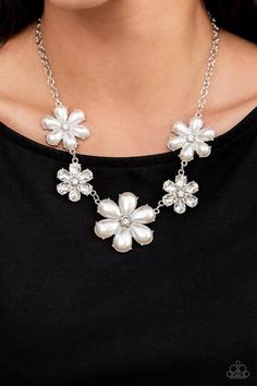 Featuring glassy white rhinestone centers, bubbly pearl petaled flowers gradually increase in size as they alternate with white rhinestone petaled flowers below the collar for a fierce floral fashion. Features an adjustable clasp closure. Sold as one individual necklace. Includes one pair of matching earrings. #P2ST-WTXX-110XX LIFE OF THE PARTY DECEMBER 2021 WHITE FLOWER NECKLACE Get 1st Dibs Access to new, hot items added daily here! Join bee for Live Shows on Facebook here! Enjoy Bee's video's White Choker, Bling Fashion, Feeling Pretty, White Pearl Necklace, Party Necklace, Life Of The Party, Paparazzi Accessories, White Necklace, Floral Fashion