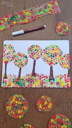 an art project for kids to make with gummy bears and paper plates on the table