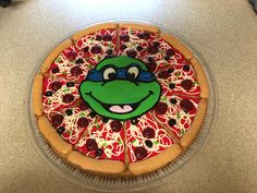 a pizza with toppings on it sitting on top of a counter