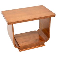 a small wooden table with one shelf on the top and two shelves below it that are made out of wood