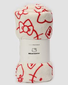 the hello kitty blanket is on display in front of a white background with red and black designs