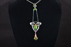 A gorgeous sterling silver and enamel double drop art nouveau style lavalier pendant necklace.  The pendant comes with a later link chain (added by me)with spring ring clasp. Necklace sizes: The main link chain overall measures approximately 458mm x (about 18") end to end. Each pendant link chain measures about 30mm (1 and 3/16") long.  The pendant (incl drops) measures approximately 90mm long (about 3 and 1/2") x 26mm (about 1") and in total weighs about 6g. Condition: The chain is stamped for Clasp Necklace, Art Nouveau Style, Small Pendant, Silver Enamel, Necklace Sizes, Style Art, Spring Rings, Link Chain, Pendant Necklaces