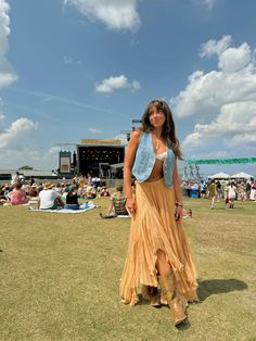 festival outfit. free people. long skirt. flowy skirt. denim vest. music festival. concert outfit. coachella. highwater music festival. summer outfits. boho. beachy. cowboy boots. charleston south carolina. Flowy Skirt Summer Outfit, Country Musical Festival Outfit, Boho Flowy Skirt Outfit, Boston Calling Festival Outfits, Western Outfits Women Festival, Cowboy Boots Outfit Long Skirt, Hinterland Outfit Ideas, Concert Outfit Long Skirt, Festival Outfit Long Skirt