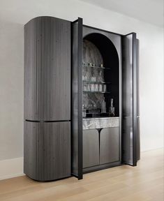 a tall cabinet sitting in the middle of a room