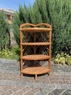 a wooden shelf sitting on top of a brick sidewalk