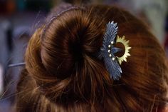 The Raven hairpin is a unique hair accessory, hand--forged from blackened steel.  It is made in the shape of a raven, which makes it not only functional, but also decorative, and the brass sun gives it a particularly refined look with its contrast.  Due to its strength and reliability, the forged hairpin "Raven" will serve you for many years. She will not lose her appearance and will delight you with her beauty and elegance. This accessory will be a great addition to any outfit and will emphasize your personality. Do not miss the opportunity to purchase this unique accessory for your hair! Size: 160 х 50 х 5 mm Weight: 22 g If you have any questions, please contact us and we will definitely give a respond! Grand Jewellery, Raven Accessories, Raven Feather, Ritual Magic, Unique Hair Accessories, Feather Hair Clips, Goth Wedding, Blackened Steel, Unique Hair