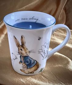 a coffee cup with an image of a rabbit on it