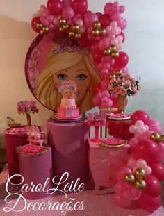 a barbie birthday party with pink and gold decorations