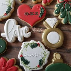 decorated cookies on a wooden table with the words love