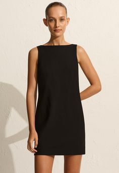 Reminiscent of the the 90s, our Crepe Mini Shift Dress is crafted in our easy-wear, lightweight wool-blend crepe. Featuring a relaxed shift silhouette, boat neckline and invisible centreback zip. Effortlessly elegant, it’s the only dress you need to pack for your next summer city escape. 90s Minimalism, Minimalist Clothing, Tailored Clothes, Shift Dress Black, The Invisible, Dress Silhouette, Boat Neckline, Mini Shift Dress, Daily Look