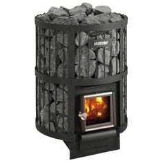 a black stove with rocks in it and the door open to show firewood inside