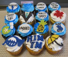 cupcakes with frosting and decorations are arranged on a table in front of a sign