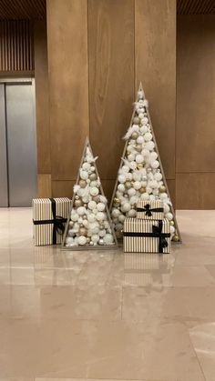 two small christmas trees made out of rocks