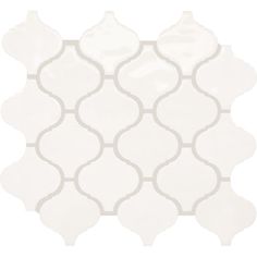 a white tile with an intricate design