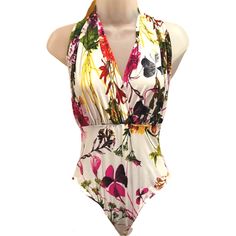 Glamazon Halter Bodysuit Floral White Size Medium Preowned: Never Worn Multicolor Fitted V-neck Swimwear, Amazon Sleeveless Swimwear For The Beach, Fitted Sleeveless Swimwear By Amazon, Chic Multicolor Stretch Swimwear, Chic Stretch Multicolor Swimwear, Fitted One-piece Bodysuit With Tropical Print, Fitted Multicolor Summer Bodysuit, Fitted One-piece Tropical Print Bodysuit, Fitted Tropical Print One-piece Bodysuit