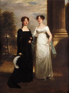 two women in formal dress standing next to each other