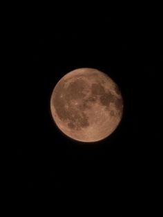 the full moon is seen in the dark sky