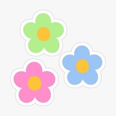 three flower stickers with different colors on the side and one has an orange center