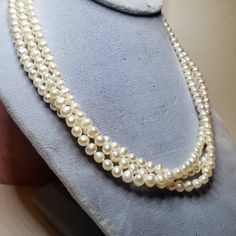 "Lovely vintage freshwater baroque cultured pearl necklace. 3 strands with a sterling chain and hook clasp. A really neat detail on this necklace are the clasp ends, which are sterling hearts. Marked \"935\" Unidentified makers mark. It looks like a lower case e inside of a diamond. Condition is excellent. Ready to wear. There are no dents or dings. No loose or missing pearls. No repairs." Formal Antique Pearl Drop Necklace, Vintage Pearl Necklace With Pendant, Victorian Pearl Necklaces For Formal Occasions, Antique Pearl Chain Necklace For Formal Occasions, Antique Formal Pearl Chain Necklace, Antique White Pearl Necklaces, Vintage Pearl Necklace With Pearl Charm For Formal Occasions, Vintage Round Pearl Necklace For Formal Occasions, Vintage Pearl Necklace For Formal Occasions