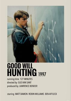 a young man writing on a blackboard with the words good will hunting written on it