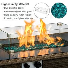 an outdoor fire pit with glass top and flames